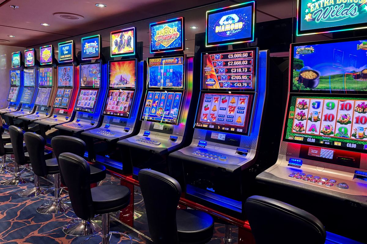 Slot machines lit up inside a Papua New Guinea online casino