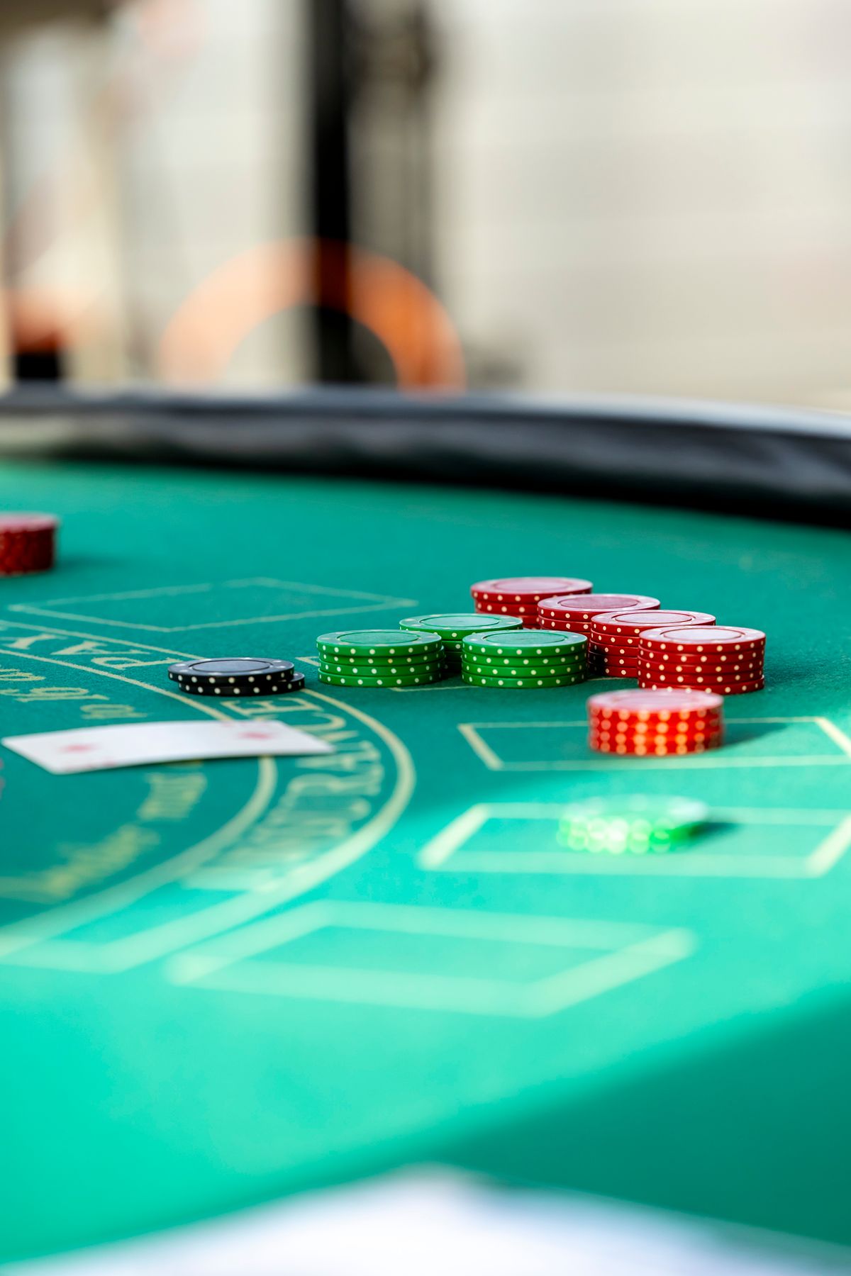 Stack of casino chips on a green felt table