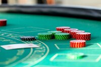 Stack of casino chips on a green felt table