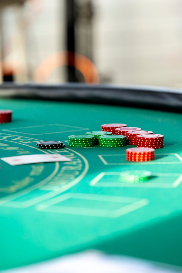 Stack of casino chips on a green felt table