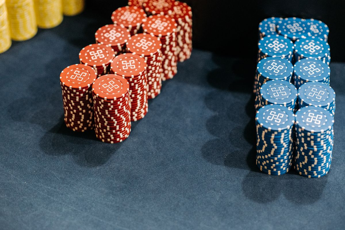 Close-up of neatly stacked casino chips on a gaming table