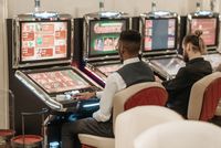 Players at slot machines